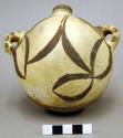 Polychrome pottery small canteen - red, black, white.