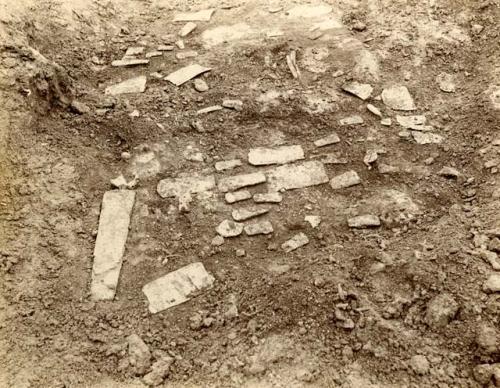 Small flat archaeological finds in field.