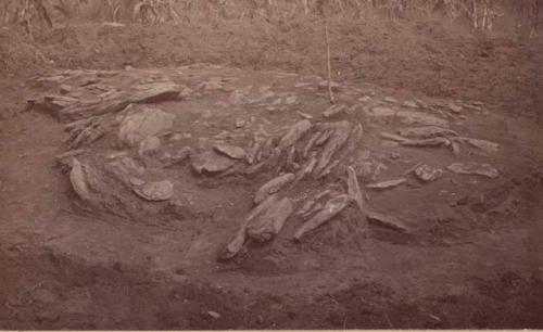 Second view of grave on hill.