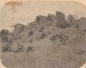 Pueblo ruin at Aztec. Village wall(?) on hill, taken from below.