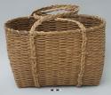 Antique carrying basket with two braided handles; very faded