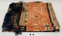 Man's shoulder or hip cloth, hinggi; indigo, red and tan with tan, red and blue ikat designs of ancestors, animals