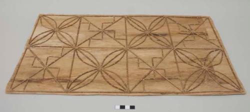 Kupesi design board with Frangipani flower and geometric motifs