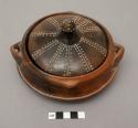 Pot with two applied handles, lid with incised pattern and knob