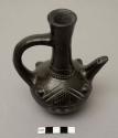 Small coffee pot, "jebena," with tall neck, applied handle, short spout; incised pattern and four applied knobs on body of pot; burnished