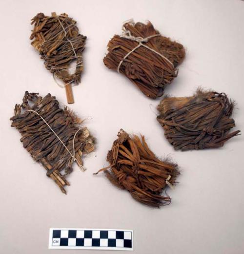 Fiber fragments, bundled with white string