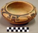 Pottery bowl with incurving rim; orange-slipped ware with black and umber painte