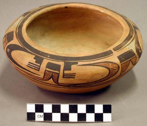 Pottery bowl with incurving rim; orange-slipped ware with black and umber painte