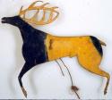 Love charm. Rawhide cut in shape of elk. Painted in yellow and blue.