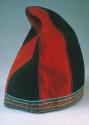 Cloth hat of alternating red and dark blue wool cloth with a beaded border