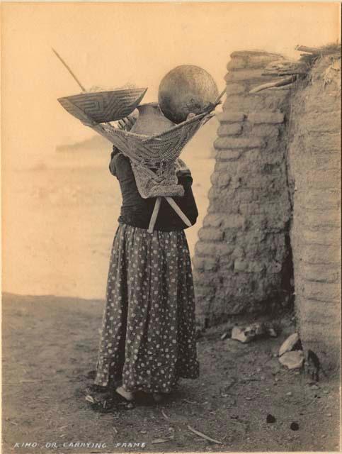 Woman carrying basket and pot in kiho