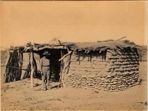 Man standing in front of a house