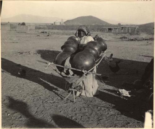 Woman with large pots