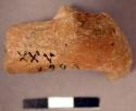 Fragment of animal figurine. cylindrical body, broken in middle. two legs missin
