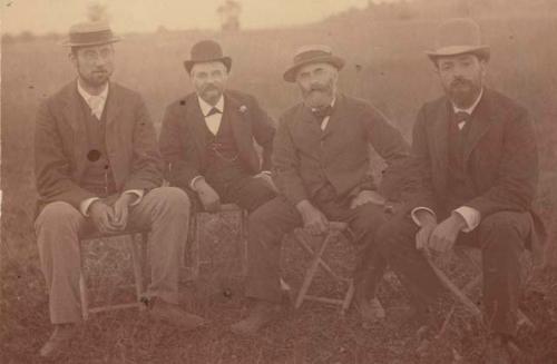 Kimball, Lowe, Putnam and Metz sitting for photograph at Turner Group