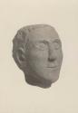 3/4 view of face of stone sculpture found by farmer.