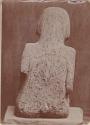 Carved stone human figure, back