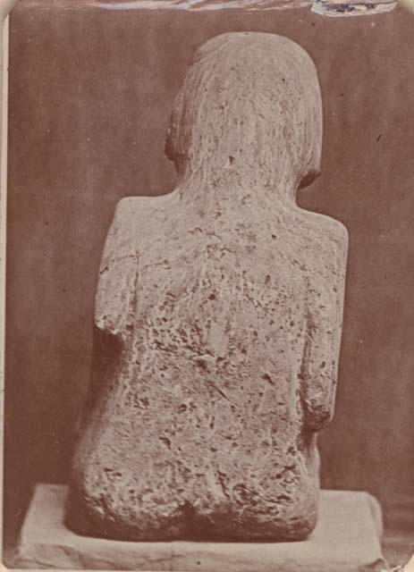 Carved stone human figure, back