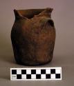 Small plain pottery jar - 2 handles, blackened