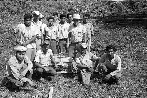 Men with crated fragment from Tamarindito