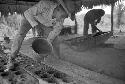 Lisandro Flores pouring panela into molds