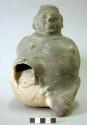 Ceramic effigy vessel, human form, kneeling male figure, leg broken off, spallin