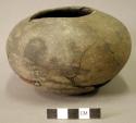 Ceramic complete vessel, sherds missing from body, mended, broken footed ring