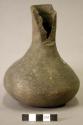 Ceramic complete vessel, long neck, part of neck broken off, plain