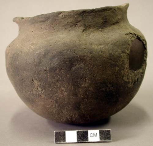 Ceramic vessel, short necked, two flat handles.