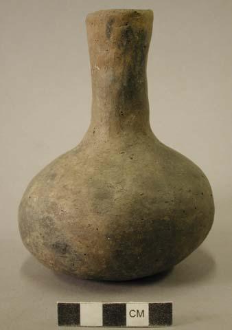 Ceramic vessel with long neck.