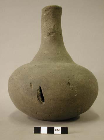 Ceramic vessel with long neck.