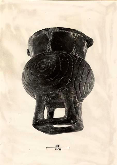 Vessel with inscribed design and stand on bottom