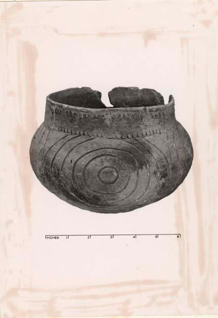 Vessel with circular design.