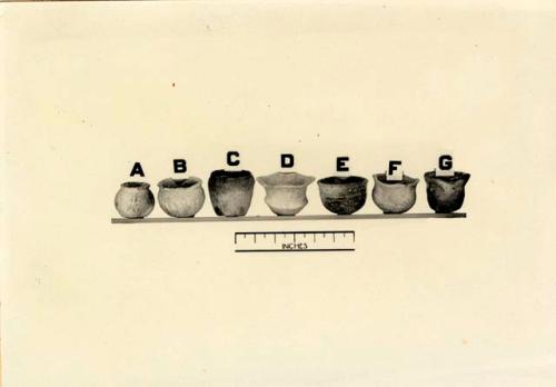 Seven tiny vessels from burials, some of which were found in graves of children