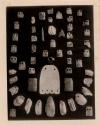 Ornaments of Mother of Pearl, two arrow heads, ivory bead and two bone ornaments