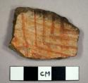 Mogollon red-on-brown potsherd