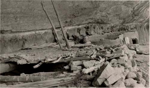 kiva and round storehouses of adobe and boulders