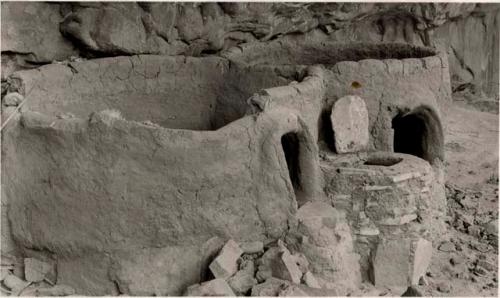 Round storehouses of adobe and boulders