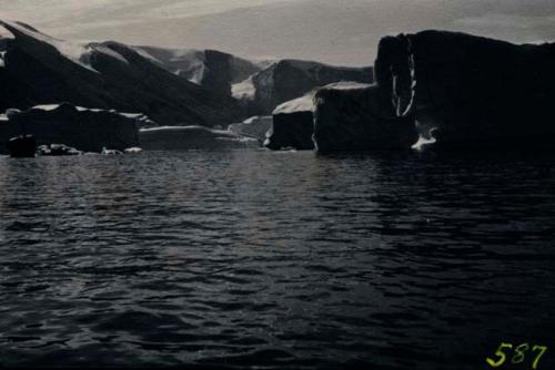 Icebergs in bay. Members of Explorer's Club on expedition