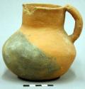 Pitcher; shouldered, medial. with one handle small mouth. gila red. 12.5 x 13.4