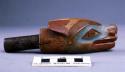 Pipe of wood and metal with painted head of wolf or bear.