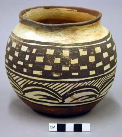 Jar, polacca polychrome style c. zuni rain bird design. 13.5 x 15.0 cm.