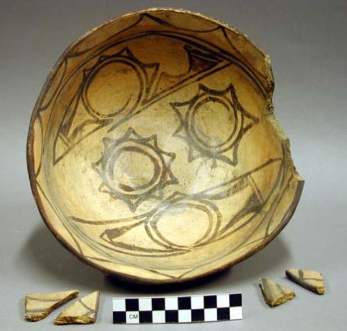 Ceramic complete vessel, bowl, brown-on-white interior, four sherds inside