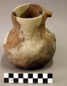 Undecorated pottery pitcher