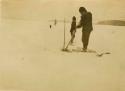 Montagnais man ice fishing