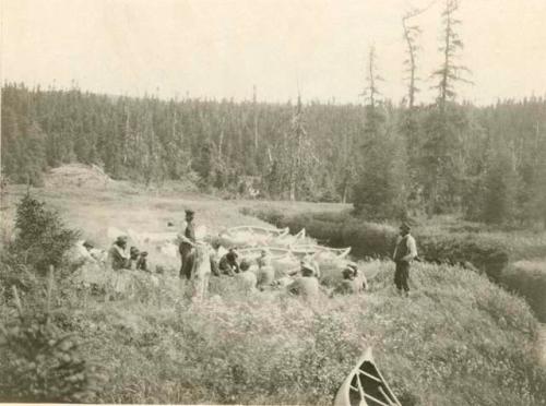 Montagnais people having lunch at end of portage