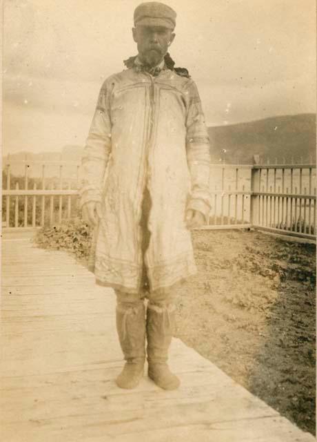 Outdoor shot of man wearing summer coat