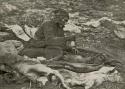 Woman pounding pemmican, Ussijusque