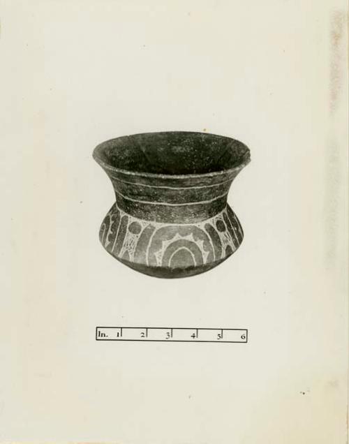 Bowl with red slip with carved design, representing the sun symbol