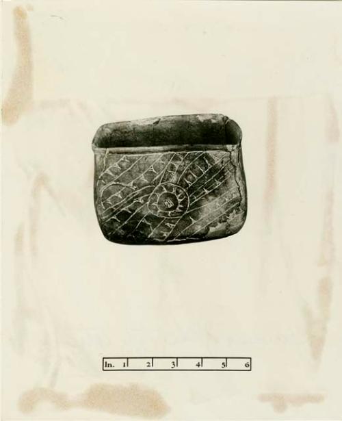 Rectangular vessel with incised design (variant of sun symbol)